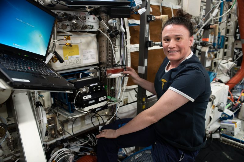 Caption: NASA astronaut works with Redwire’s Bone Densitometer on the ISS. (Credit: NASA)
