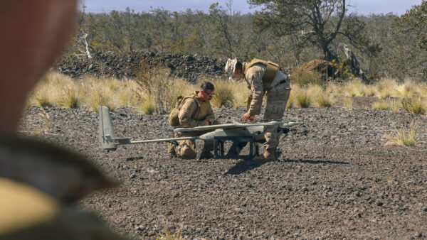 U.S. Marine Corps Sgt. William Hood, left, and Sgt. Juan P. Afanador, both small unmanned aircraft systems operators with 3rd Littoral Combat Team, 3rd Marine Littoral Regiment, 3rd Marine Division, disengage the wings on a VXE-30 Stalker unmanned aerial system during a live-fire training exercise at Pohakuloa Training Area, Hawaii, Feb. 1, 2026. The training exercise at PTA refined weapon system and tactical proficiency, strengthening overall combat readiness and preparing 3rd LCT for future operational requirements. Hood is a native of Indiana and Afanador is a native of Florida. (U.S. Marine Corps photo by Cpl. Ernesto Lagunes)