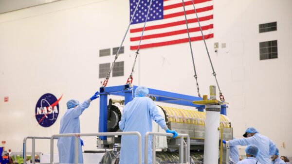 Caption: iROSA wings five and six undergo flight package integration in the Space Station Processing Facility at NASA’s Kennedy Space Center in Florida. (Credit: NASA)